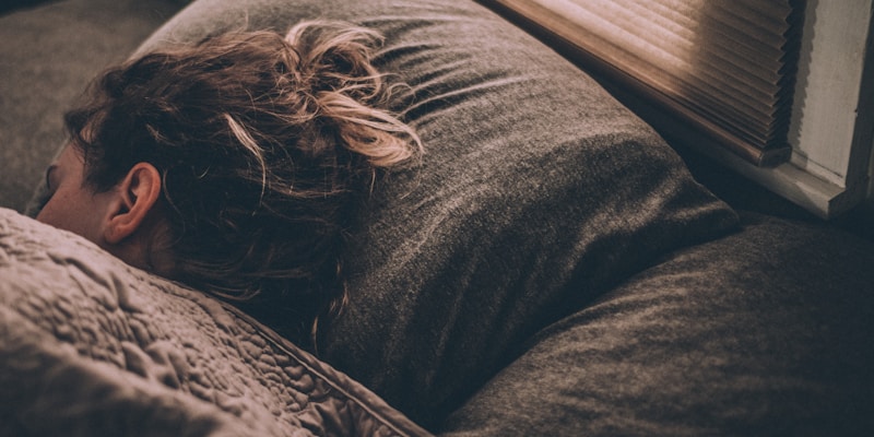 Relaxed person preparing for restful sleep after evening sauna session
